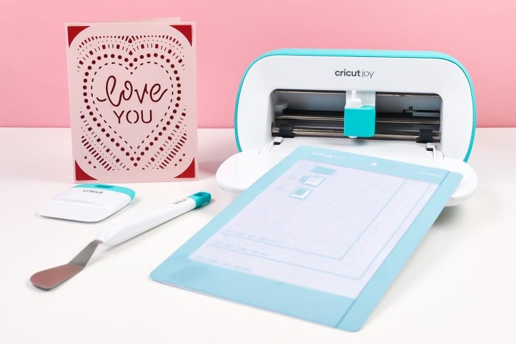 Cricut Joy with Card Mat and I Love You Card and Cricut tools.