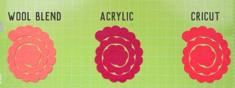 Three flowers cut out of three felts on the Cricut mat using the Rotary Blade