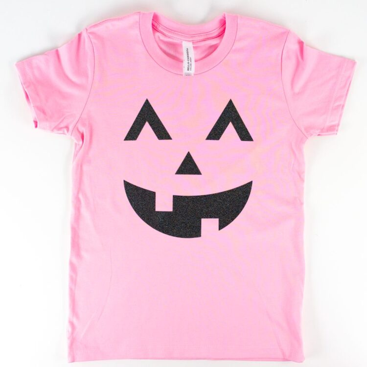 Pink t-shirt with black glitter jack-o-lantern transfer