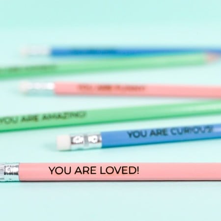 Engraved Pencils on Blue Background