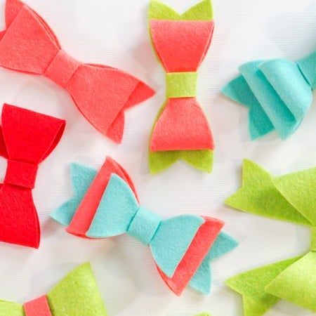 Image of completed felt bows in red, aqua and green colors